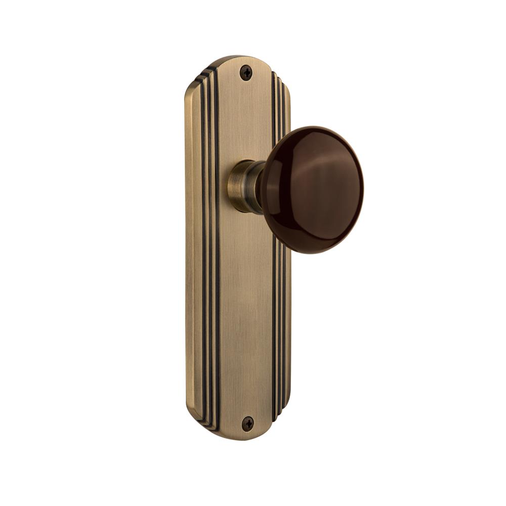 Nostalgic Warehouse DECBRN Complete Passage Set Without Keyhole Deco Plate with Brown Porcelain Knob in Antique Brass